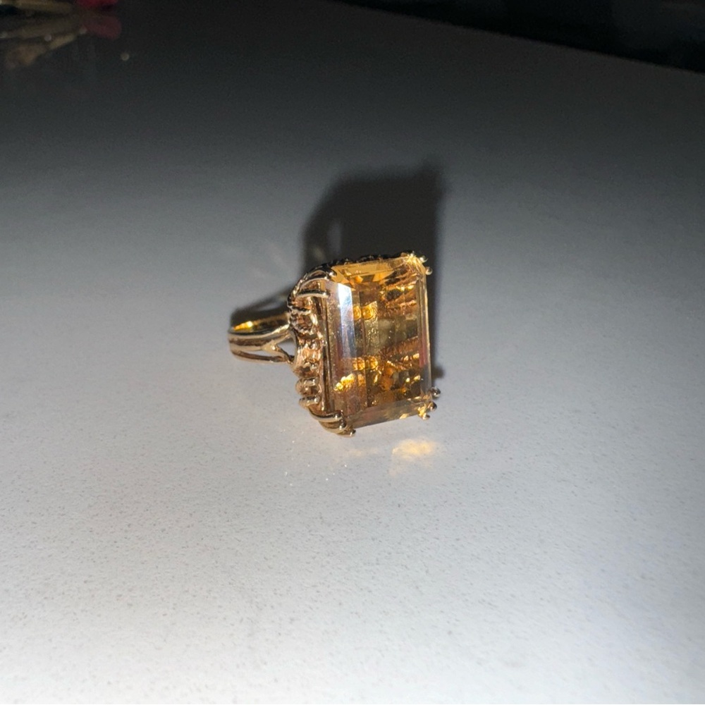 Yellow gold gemstone emerald cut ring